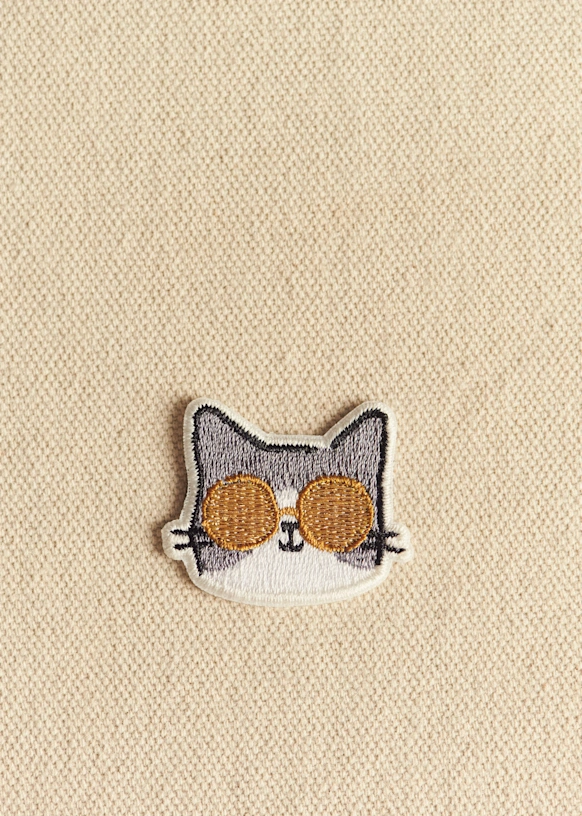 Símbolo del emblema - Gato con gafas